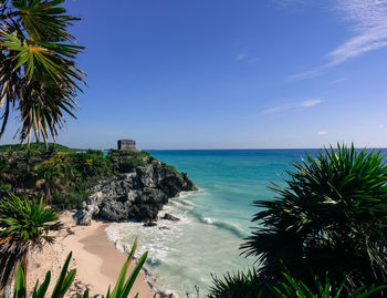 Scenic view of sea against clear blue sky