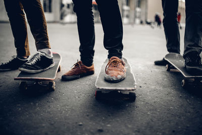 Low section of men on skateboards