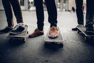 Low section of men wearing shoes