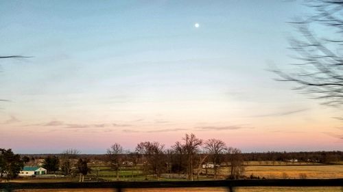 Scenic view of field against sky during sunset