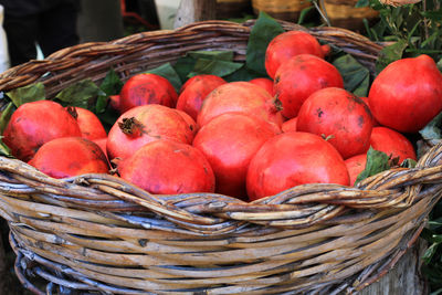 Close-up of pomegranates in basket for sale