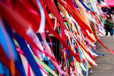 Close-up of multi colored flags hanging