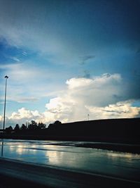 View of road against cloudy sky