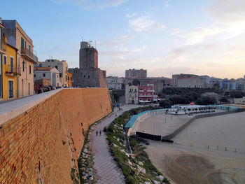 View of town against sky during sunset