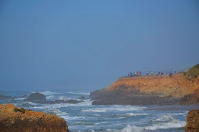 Scenic view of sea against clear blue sky