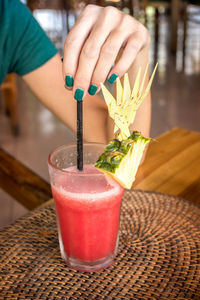 Fresh organic watermelon juice on a wooden background. tropical cafe on bali island.