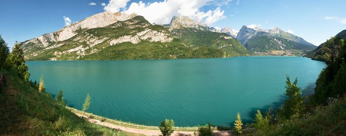 Town and lake with the same name molveno lake nestled in the dolomites in trentino alto adige, italy