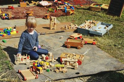 Full length of girl playing with toy