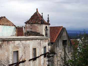 Exterior of old building in city against sky