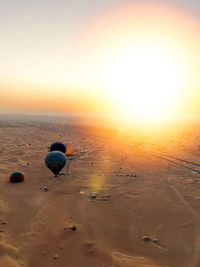 Scenic view of beach against sky during sunset