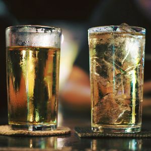 Close-up of beer glass on table