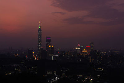 Illuminated buildings in city at night