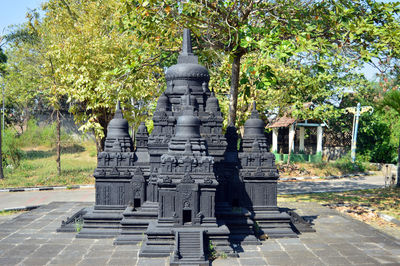 View of temple against building