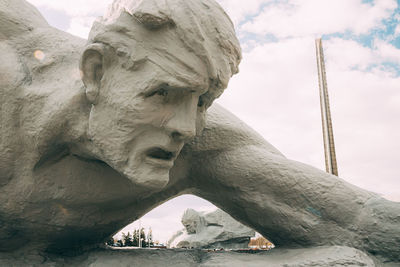 Low angle view of statue against cloudy sky