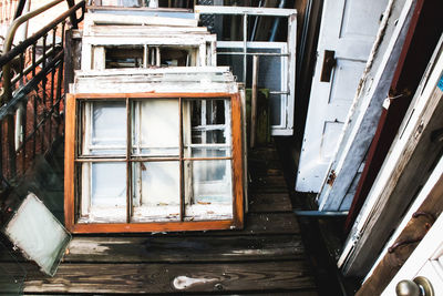 Abandoned window frames on porch