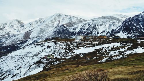 Scenic view of snowcapped mountains against sky