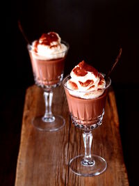 Close-up of chocolate panna cotta on table against black background