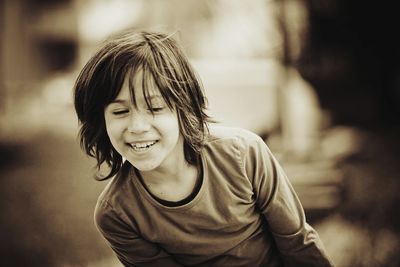 Happy boy looking down