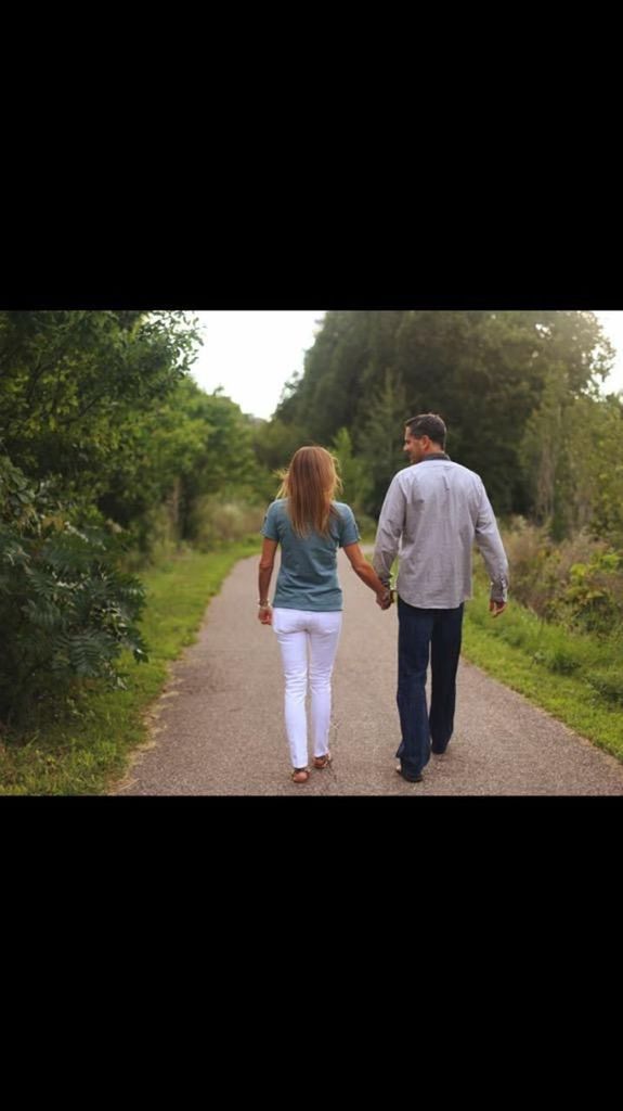 FULL LENGTH REAR VIEW OF WOMAN STANDING IN PARK