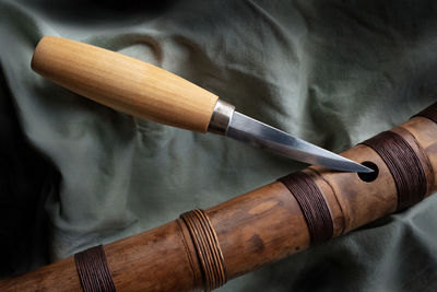 Close-up of knife and bamboo