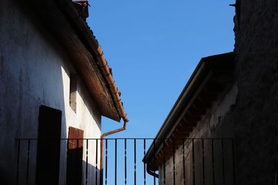 Low angle view of building against clear blue sky