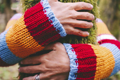 Midsection of woman wearing hat