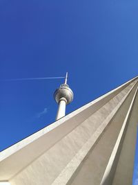 Low angle view of communications tower against sky