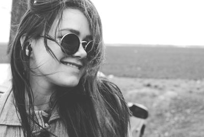 Portrait of girl wearing sunglasses against sky