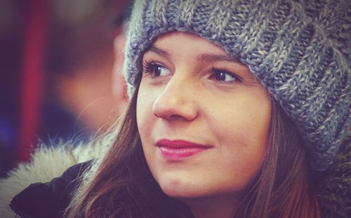 Close-up of thoughtful woman wearing knit hat