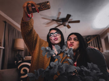 Portrait of hispanic women taking a selfie