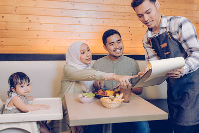 High angle view of people sitting at table