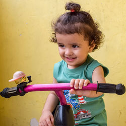 Cute little boy shivaay driving cycle at home balcony during summer time, sweet little boy