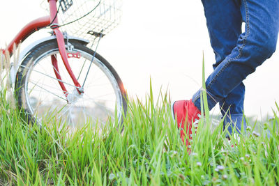 Low section of person with bicycle