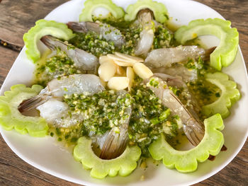 High angle view of vegetables in plate on table