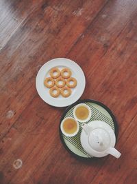 Directly above shot of food in plate by tea