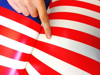 Close-up of hand holding flag