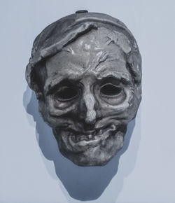 Close-up of human skull against white background