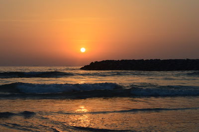 Scenic view of sea against sky during sunset