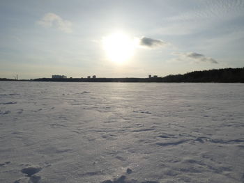 Scenic view of frozen sea against sky during sunset