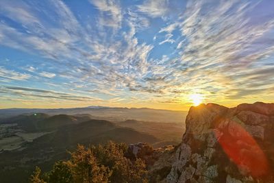 Scenic view of landscape against sky during sunset