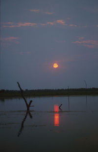 Scenic view of sunset over calm sea