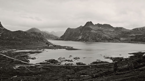 Scenic view of lake and mountains against sky