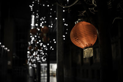 Illuminated lanterns hanging at night