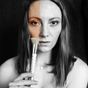 Close-up portrait of a young woman drinking coffee