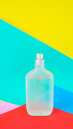 High angle view of bottle on table against blue background