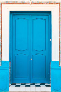 Closed blue door of building