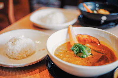 Close-up of soup served on table