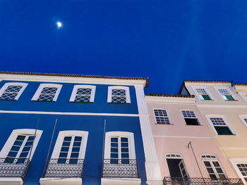 Low angle view of building against blue sky