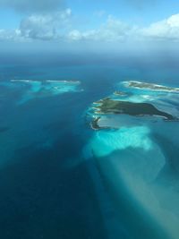 Aerial view of landscape and sea against sky