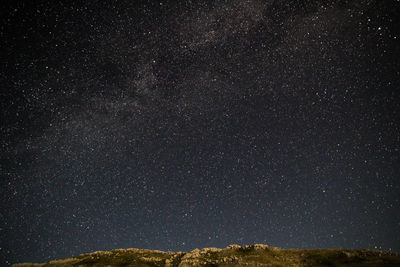 Low angle view of stars in sky at night